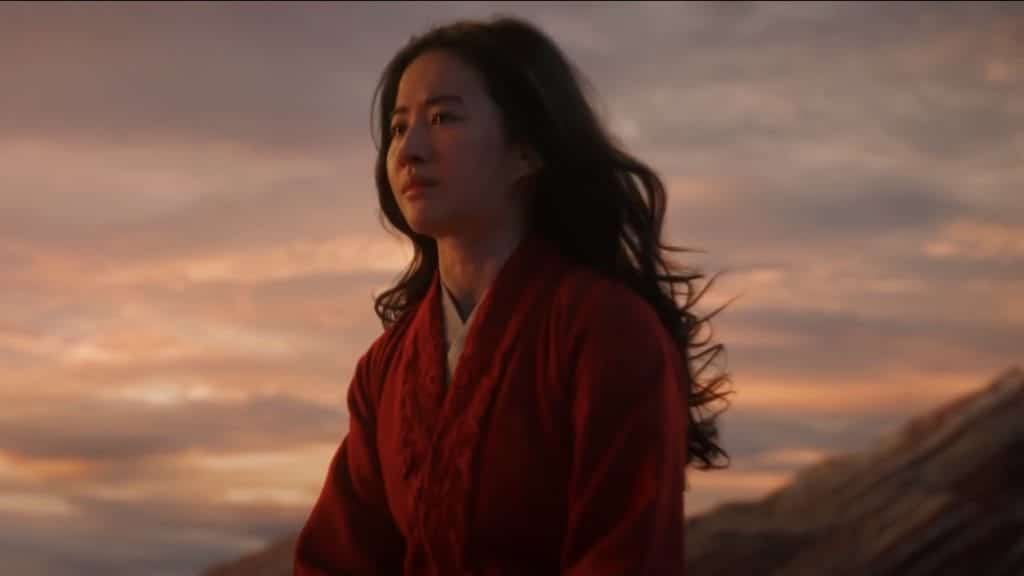 Mulan (Liu Yifei) looks into the distance after being banished from the army.