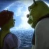 Shrek and Fiona stare into each other's eyes, a full bright moon illuminating them.