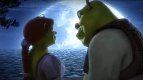 Shrek and Fiona stare into each other's eyes, a full bright moon illuminating them.