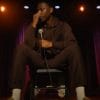 Jerrod Carmichael doing stand-up in Jerrod Carmichael Reality Show (2024). Credit: YouTube/TrailerCheck