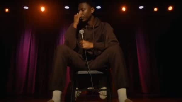 Jerrod Carmichael doing stand-up in Jerrod Carmichael Reality Show (2024). Credit: YouTube/TrailerCheck