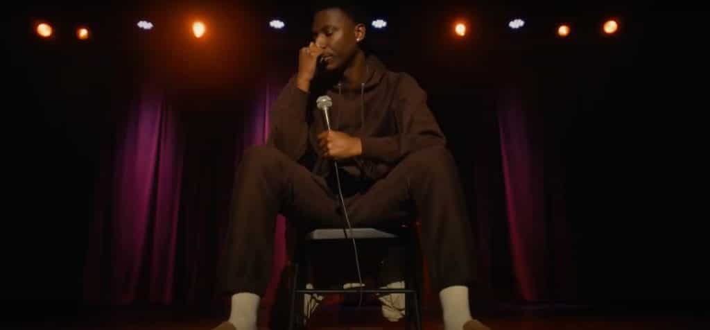 Jerrod Carmichael doing stand-up in Jerrod Carmichael Reality Show (2024). Credit: YouTube/TrailerCheck