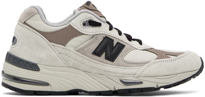 A pair of neutral colored sneakers.