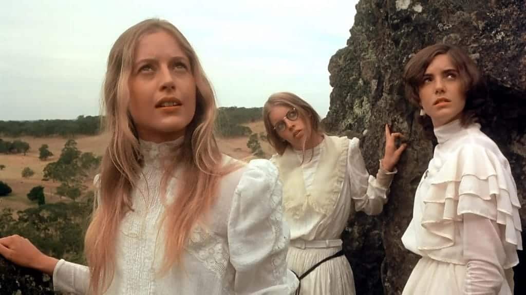 Three girls explore the cliffs of Hanging Rock in springtime.