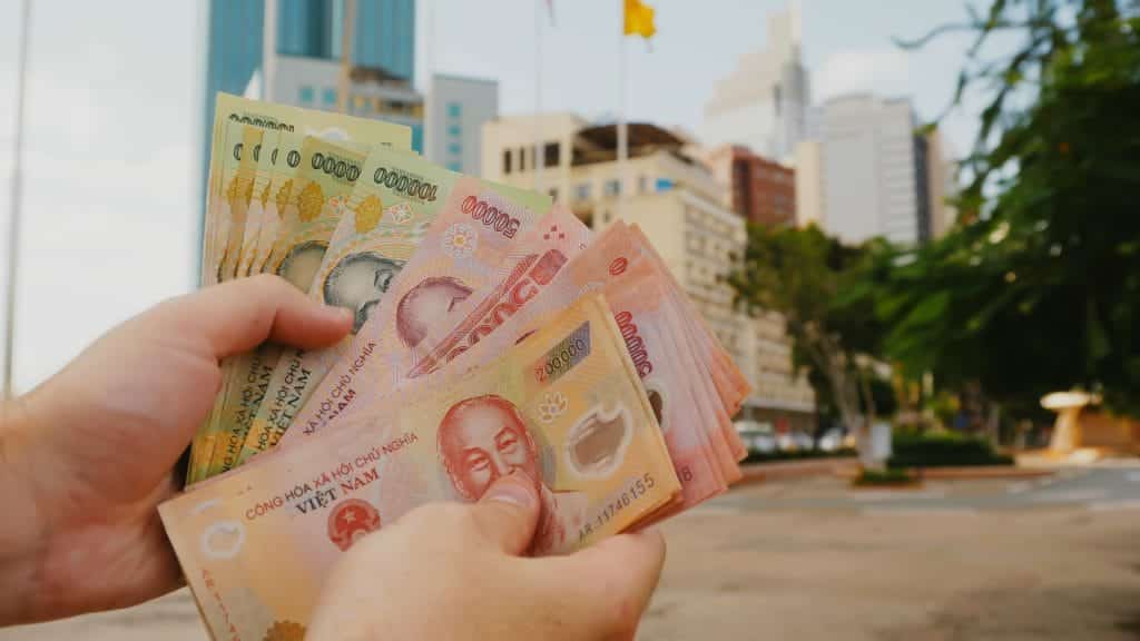 Man Counts Money In Ho Chi Minh City.