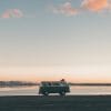 A minivan in front of a Utah sunset and the Bonneville Salt Flats.