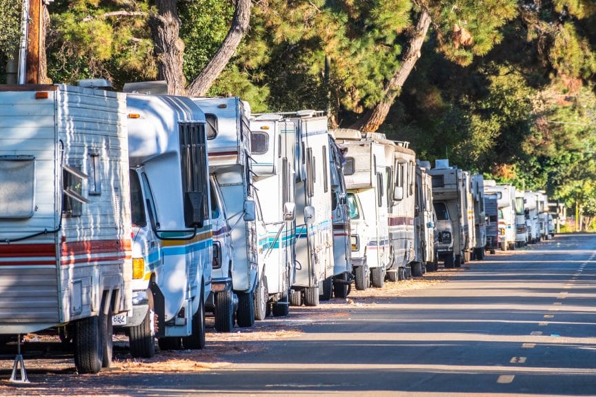 Nov 4, 2019 Mountain View / CA / USA - Campers and RVs parked close to each other on a public street in Silicon Valley; symbol of the housing crisis existing in the San Francisco Bay Area.