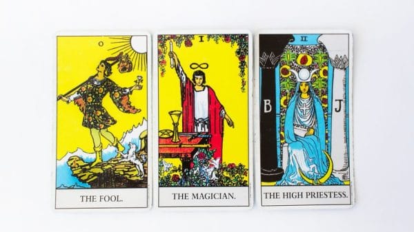 The Fool, Magician and High Priestess are laid out on a table.
