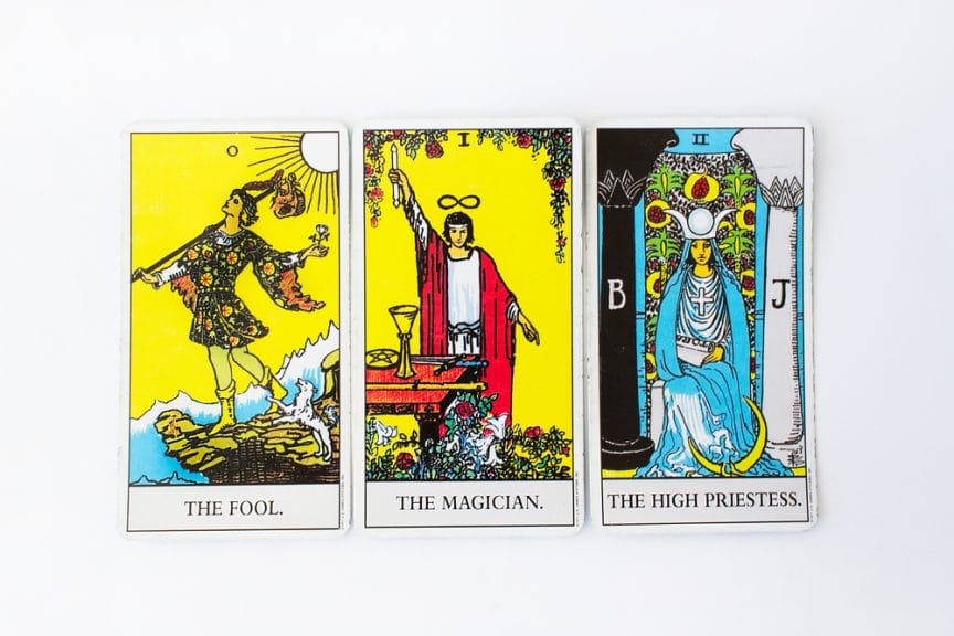 The Fool, Magician and High Priestess are laid out on a table.