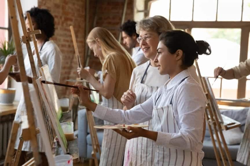 two women painting together