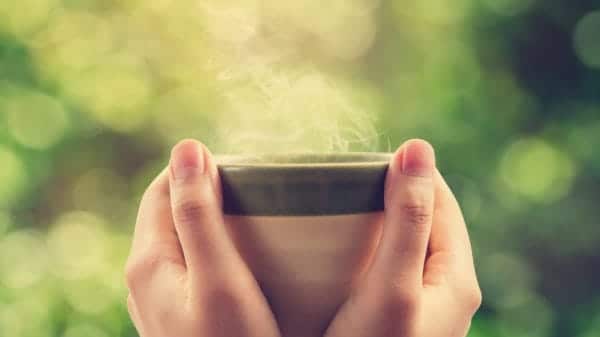 hands holding a mug steaming hot drink coffee alternatives