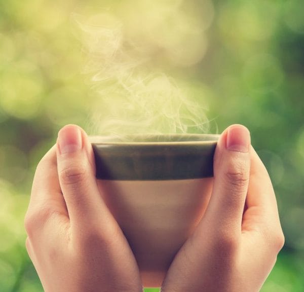 hands holding a mug steaming hot drink coffee alternatives