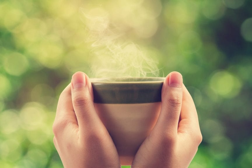 hands holding a mug steaming hot drink coffee alternatives