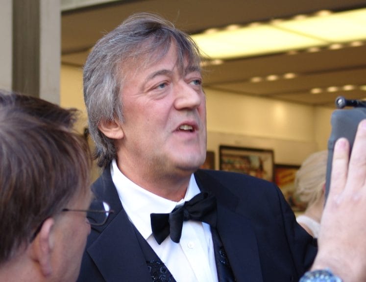 Stephen Fry pictured on a red carpet.
