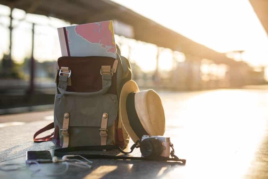 Travel rucksack, hat and camera
