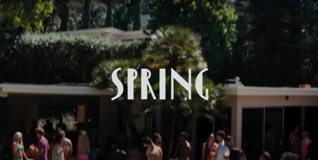 A brightly colored party scene with the word "Spring" in big bold text written over it. Screenshotted from the 2016 film La La Land.