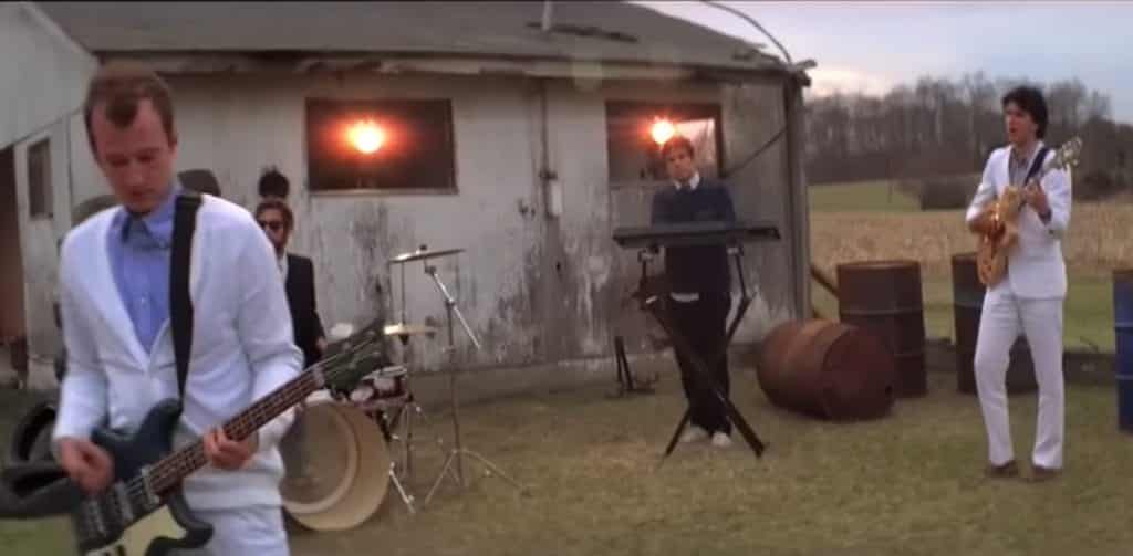 Vampire Weekend performing outside of an old house in the music video for their song "Oxford Comma".