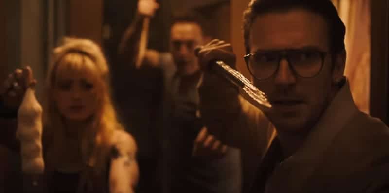 Vampire hunters, they are not. Dan Stevens, Kathryn Newton and Kevin Durand try to stay alive in 'Abigail', the three of them holding up various anti-vampire weapons such as garlic.