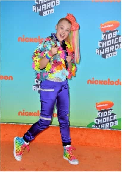 JoJo Siwa at the Nickelodeon Kid's Choice Awards orange carpet