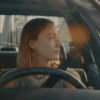 Saoirse Ronan looks emotional as she drives through Sacramento in the ending of "Lady Bird".