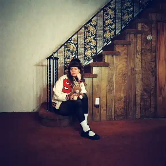 Pouty sat at the bottom of a set of stairs