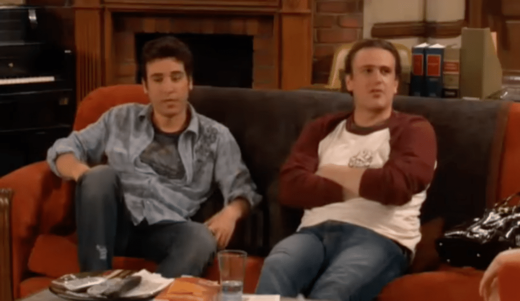 Two of the main characters in TV show How I Met Your Mother, Ted and Marshall sit on a couch explaining the phenomenon "revertigo".