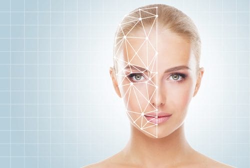 Portrait of a woman with a scanning grid on her face. Face id, security, facial recognition concept.