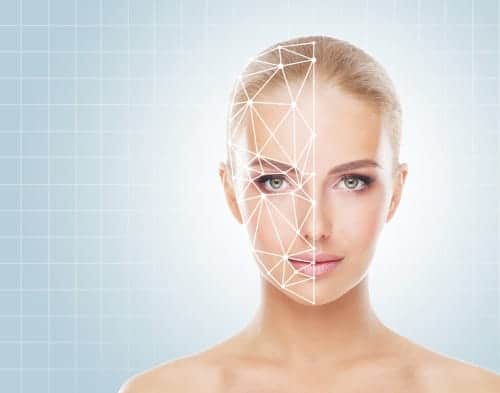 Portrait of a woman with a scanning grid on her face. Face id, security, facial recognition concept.