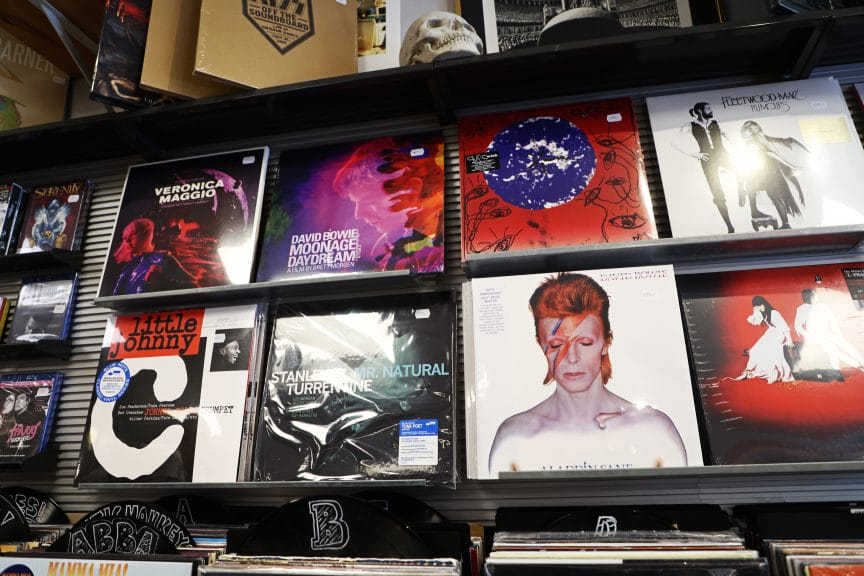 Vintage record store displays records by the Cure and David Bowie, both of whom fall under the genre of "manipulator music"