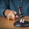 A hand holding a gavel hovering over the word "AI."