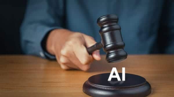 A hand holding a gavel hovering over the word "AI."