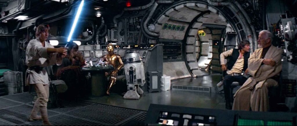 Mark Hamill, Peter Mayhew, Anthony Daniels, Kenny Baker, Harrison Ford, and Alec Guinness in Star Wars: Episode IV – A New Hope.
