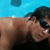 Dustin Hoffman as Ben, in The Graduate, lounges on a floatie in the pool wearing sunglasses.