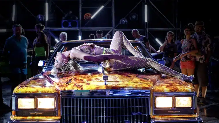 Adrian performs in a strip show on a car in this body horror perfect for pride month