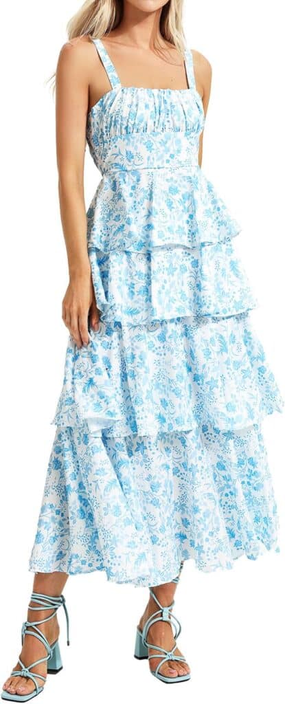 Model wearing a blue floral flowy sundress.