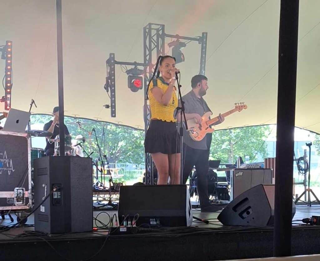 Ella More performing on the Caboose stage at Cross the Tracks