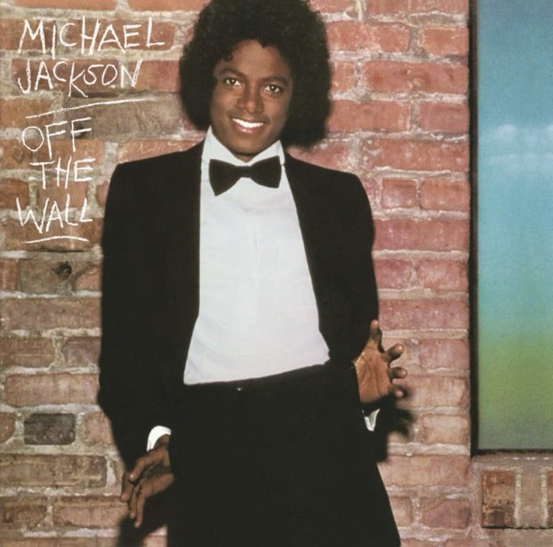 Album art featuring Michael Jackson standing in front of a wall while wearing a tuxedo.