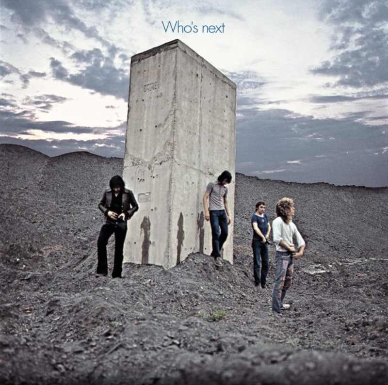Album art featuring the four members of The Who standing in front of concrete monolith.