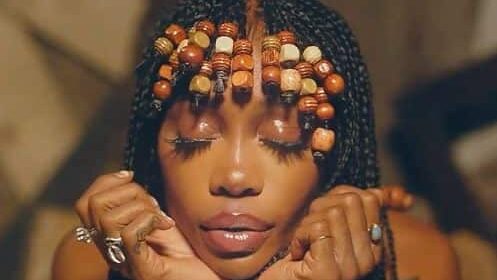 SZA with beaded braids in her GOOD Days music video.