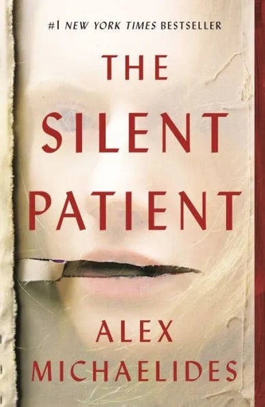 tan book cover with a faint image of a woman and a faux peeled back look across her mouth. "the silent patient" written in red text