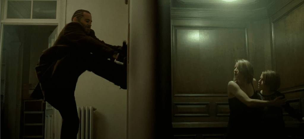 A woman and a child are trying to escape intruders down an elevator.