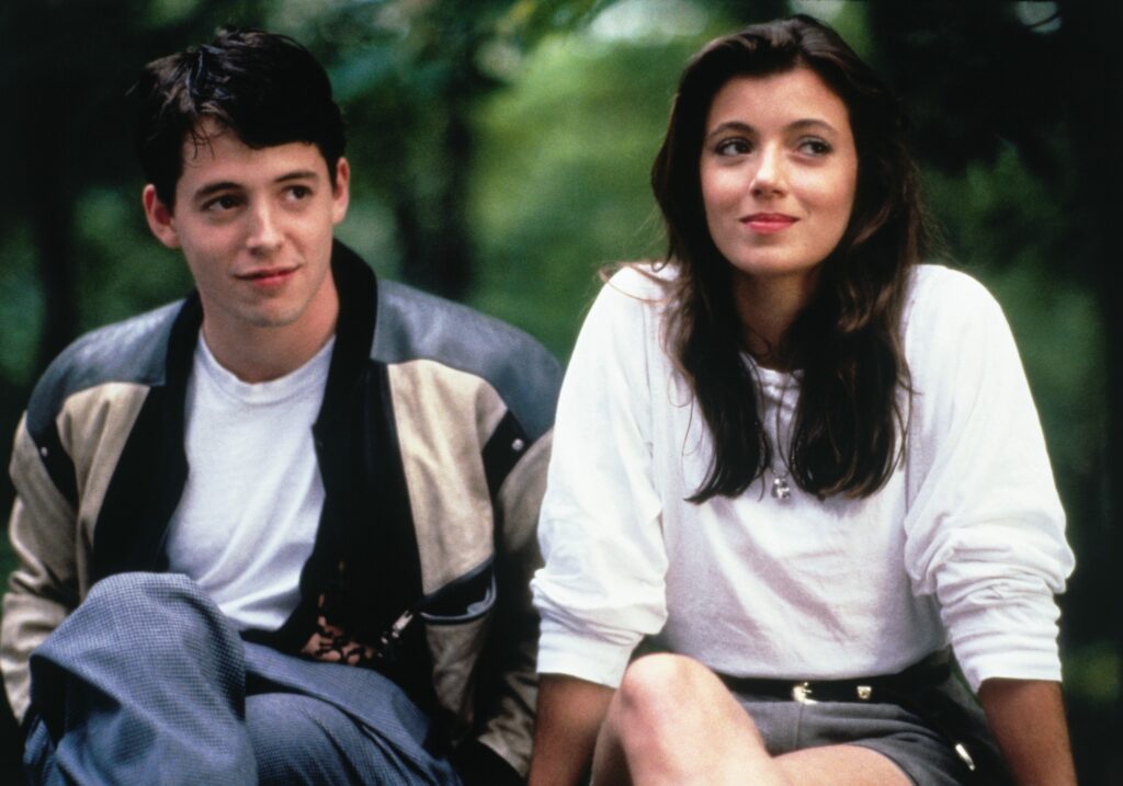 A still of Ferris and Sloane sitting next to each other.