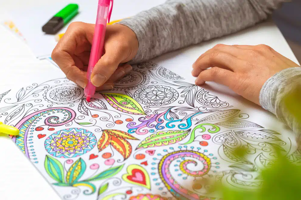 Fine art therapy helps your mental health. Drawing and painting is good for expressing your emotions. In this art therapy example, a person is drawing a colorful, emotional artwork.