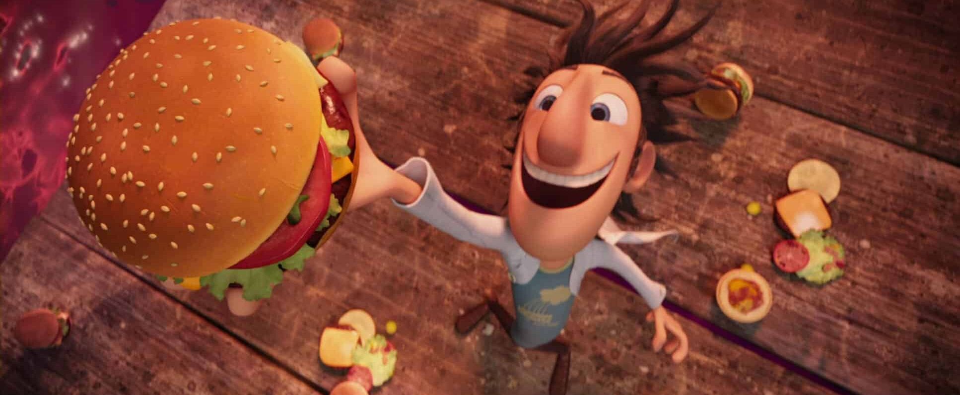Flint Lockwood grinning at the sky as he holds one of his burgers.