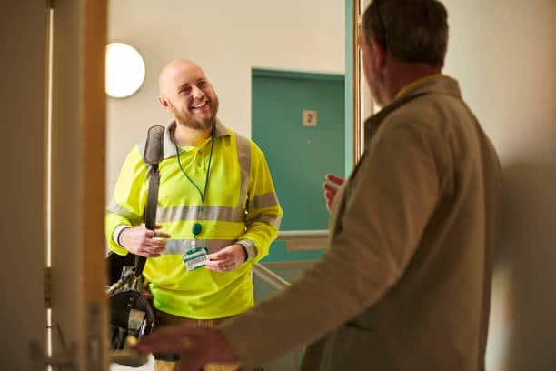 Friendly contractor in an apartment block.
