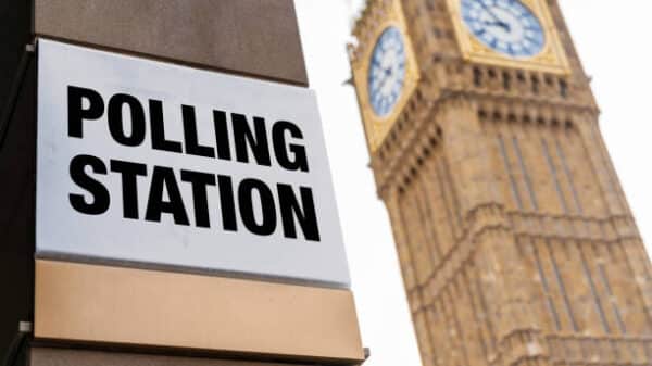 Closeup of polling station sign in front of Westminster.