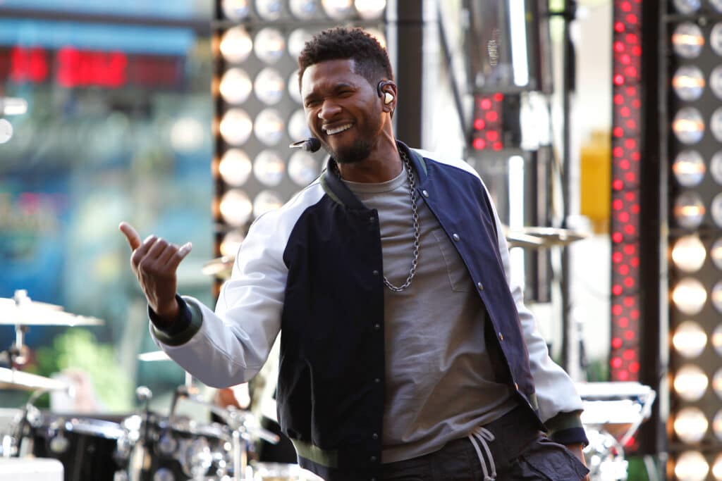 Usher performing on stage.
