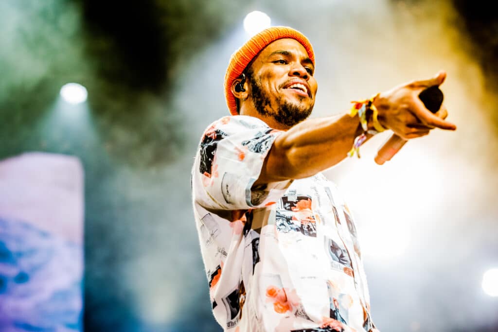 Anderson .Paak pointing on stage.