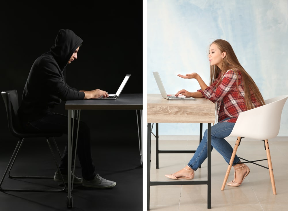 Stock image of scammer sitting at computer across from woman on her own computer.