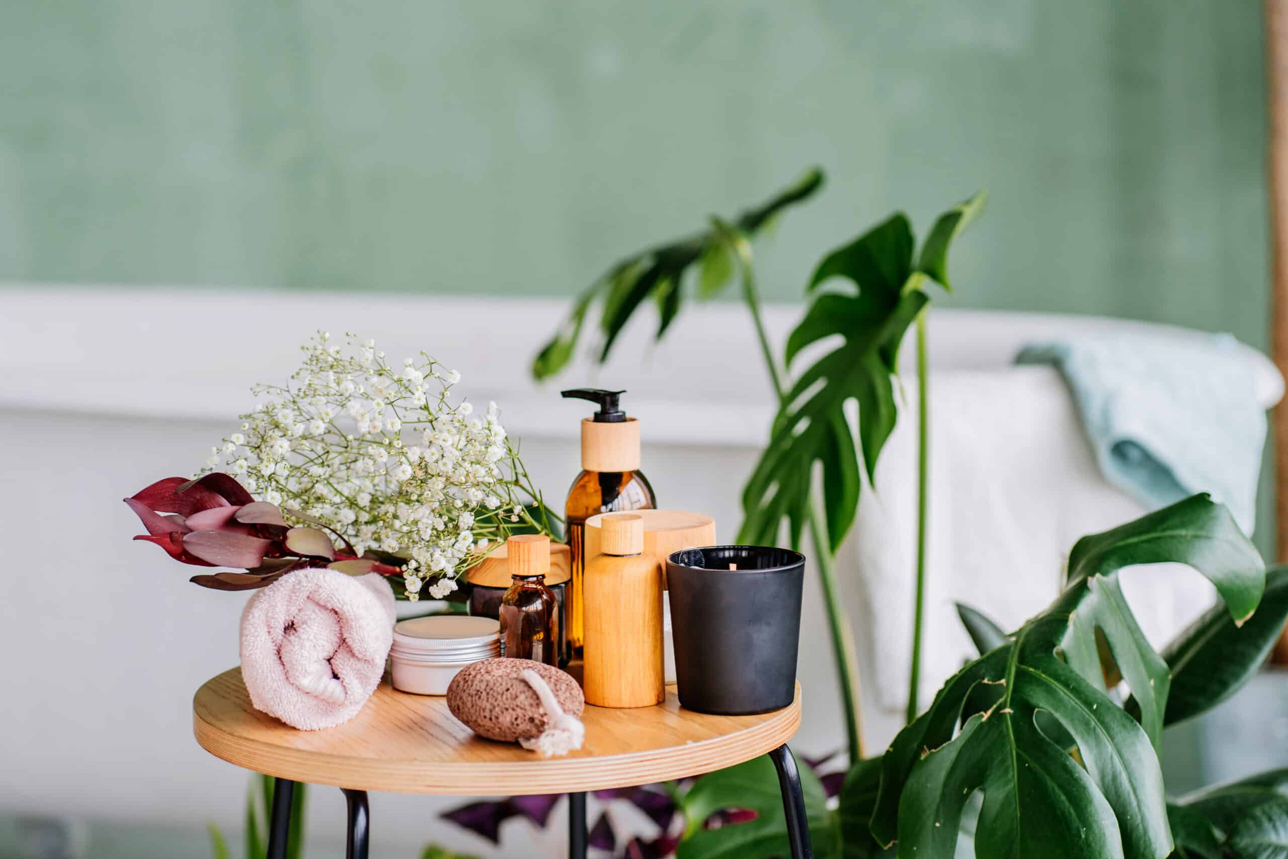 Photo of eco spa toiletries on a table sitting in front a bath.